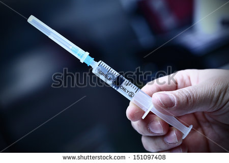 stock-photo-syringe-in-the-rough-hand-of-a-drug-addict-151097408