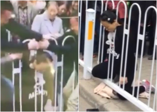 孕妇双膝跪地，颈部卡在护栏之间，市民试图掰开栏杆救人。（网络图片）