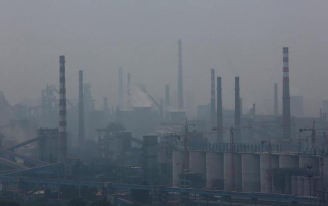 A steel factory is seen in smog during a hazy day in Anshan