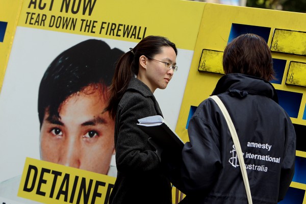 2008年7月大赦国际在悉尼举办活动,号召推翻中共长城防火墙。(GREG WOOD/AFP/Getty Images)